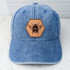 Bee Leather Hat Patch, a leather hexagon-shaped patch featuring a detailed illustration of a bee, mounted on a blue denim cap.