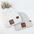 MINI Square Leather Patch, two knitted winter hats with leather patches on a white textured background.