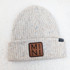 MINI Square Leather Patch, beige speckled knitted beanie hat with a brown leather patch featuring 'MINI' in black lettering.