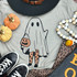 Ghost With Pumpkin Bucket Screen Print Heat Transfer, Halloween themed design featuring a ghost holding a pumpkin bucket on a gray shirt.