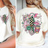 Retro Christmas Assortment DTF Transfer, colorful Christmas themed design featuring smiling ornaments, Santa Claus with glasses, candy canes, and festive elements on a white T-shirt.