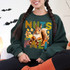 Nuts For Fall DTF Heat Transfer, colorful autumn-themed squirrel and nut graphic on a green sweatshirt.