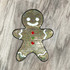Sequin Gingerbread Man Patch, a decorative patch with a smiling gingerbread figure covered in multicolored sequins.