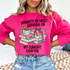Naughty Or Nice? Depends On My Current Chapter DTF Heat Transfer, pink sweatshirt with fun holiday-themed graphic and text.