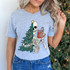 Sorta Merry Sorta Scary DTF Heat Transfer, festive skeleton with Christmas tree and candy cane on a light gray t-shirt.