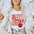 X-Mas Is So Fetch DTF Heat Transfer, a Christmas-themed graphic print on a white t-shirt featuring holiday elements and festive sayings
