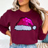 Sequin Santa Hat Patch, glittery pink Santa hat patch sewn onto a burgundy sweatshirt.