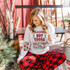 Festive Hot Cocoa DTF Heat Transfer, woman wearing sweatshirt with hot cocoa design in a cozy holiday setting