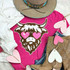Shaggy Cow Chenille Patch, a colorful animal patch featuring a cow with heart-shaped eyes on a pink t-shirt.