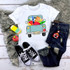 Back To School Blue Vintage Truck Sublimation Transfer, white T-shirt with a colorful vintage truck design filled with school supplies for back to school.
