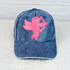 PINK CUPID Hat/Pocket Sequin Patch, blue denim baseball cap with pink sequin Cupid with bow and arrow design embroidered on front.