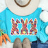 TRIPLE Bunny Chenille Patch, colorful sequin bunny patches on a turquoise shirt with a hat and jeans.
