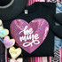 Be Mine SEQUIN HEART Patch, pink sequined heart patch with white 'be mine' lettering on a black T-shirt surrounded by small plush hearts with messages like 'XOXO', 'KISS ME', and 'CUTIE'.