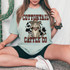 Cottontail Cattle Co DTF Heat Transfer, a graphic design of a cartoon rabbit wearing a cowboy hat, bandana, and saddle, with bold text 'Cottontail Cattle Co' in front of a black splatter background.