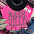 Spangled NASHVILLE Transfer, a vibrant pink t-shirt with shimmering rhinestone lettering spelling NASHVILLE.