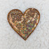 BRONZE sequin heart HAT/POCKET Patch, decorative heart-shaped patch covered with bronze sequins on a marble surface.