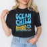 Ocean Child DTF Heat Transfer, colorful graphic t-shirt design showcasing summer and ocean-themed imagery.