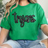 Trojans Sequin Patch, black and silver sequin letter patch spelling 'Trojans' on a green T-shirt.