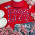 Product 1776 Blue PUFF White Stars Screen Print Heat Transfer, patriotic red t-shirt with number 1776 print featuring white stars, accompanied by American-themed accessories.
