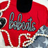 Bobcats Sequin Patch, sparkling decorative patch with the word 'behaviors' on a red shirt, styled with black boots, a beaded necklace, and star-patterned jeans.
