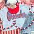 Firecracker Red and Blue Sequin Youth Patch, a colorful patch with red and blue sequins spelling 'bullcrackkon' on a light blue shirt, complemented by a red, white, and blue baseball cap and patriotic accessories.