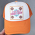 Small Town Smoke Show Embroidered Hat with Pocket Patch, orange and white trucker hat featuring colorful embroidered design and patch with text.