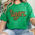 Tigers Gold Sequin Patch, a sparkling gold sequin embroidered patch on a green t-shirt featuring the word 'tigers' in a stylish script font.