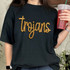 Trojans Gold Sequin Patch, a decorative gold sequin patch spelling 'Trojans' on a black t-shirt.