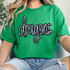 Dragons Sequin Patch, sparkling and colorful embroidered dragon design on a green t-shirt.