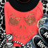 Spangled Jack Green Face Heat Transfer, a face design made of gold and green rhinestones on a coral pink T-shirt.