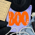 Orange BOO Sequin Patch, bright orange sequin Halloween letter patch on purple fabric.