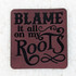 Blame It All On My Roots FAUX Leather Patch, close-up of a square faux leather patch with the phrase 'Blame It All On My Roots' in black text.