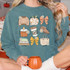 Fall Girly DTF Heat Transfer, printable design featuring autumn-themed icons like sweater weather, apple picking, bow, pumpkin spice candle, hot drinks, boots, good books, and tote bags, on a teal sweatshirt