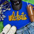 Wildcats Gold Sequin Patch, a detailed gold sequin patch representing the Wildcats logo placed on a blue t-shirt.