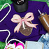 Sequin Football with Pink Sequin Bow Patch, a decorative athletic-inspired patch featuring a football with pink sequined bow accents, on a purple sweatshirt.