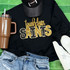 Touchdown Saints Sequin Patch, of gold and black glittered team logo on a black sweatshirt with white sneakers and a brown tumbler