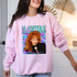 Reba DTF Heat Transfer, colorful graphic design featuring Reba McEntire on a light pink sweatshirt.