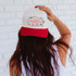 Red, White, Western DTF Heat Transfer cap, white cap with red bill featuring Western-themed icons and text.