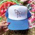 RWB Bow DTF Heat Transfer, embroidered bow design made with red, blue, and white thread on a white and blue baseball cap.