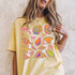 Seashells & Bows DTF Heat Transfer, colorful neon-style seashell and bow design on a yellow t-shirt.