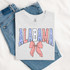 Shabby Patriotic Bow - Pick Your State DTF Heat Transfer, t-shirt with patriotic Alabama design featuring red, white, and blue colors and a bow graphic.