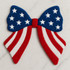 Patriotic Coquette Bow Fluffy Patch, a colorful bow featuring a blue top with white stars and red and white striped tails, ideal for patriotic celebrations.
