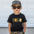 Back To School Camo DTF Heat Transfer, a young boy wearing a black t-shirt with 'PRE-K' camo print letters, camouflage shorts, a camouflage cap, and sunglasses.