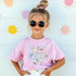 Back To School Patterned Bow DTF Heat Transfer, a colorful and trendy heat transfer decal with a bow and floral design, perfect for customizing children's clothing.