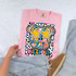 Dotted Graffiti Mascot DTF Heat Transfer, colorful graffiti-style dog design with star-shaped sunglasses on a pink t-shirt.