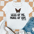 Less Of Me, More Of Him Butterfly DTF Heat Transfer, Christian quote printed on a white T-shirt with a butterfly graphic.