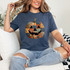 Patchwork Pumpkin DTF Heat Transfer, colorful quilted pumpkin face design on a woman's T-shirt.