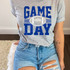 Game Day Various Colors/Puff Ink Screen Print T-shirt, a gray t-shirt with a blue distressed screen print design featuring the words 'Game Day' and a football graphic