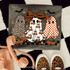 Patterned Ghost Trio DTF Heat Transfer, Halloween-themed design featuring three ghost characters with animal print and checkered patterns, decorated with pumpkins, bows, and bats.