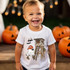 Candy Hunter DTF Heat Transfer, Halloween-themed design on a child's white T-shirt featuring a ghost wearing a Candy Hunter cap, a haunted treehouse, bats, and pumpkins.